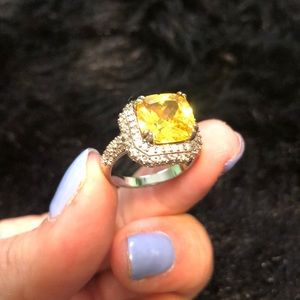 Yellow ring with diamond surround